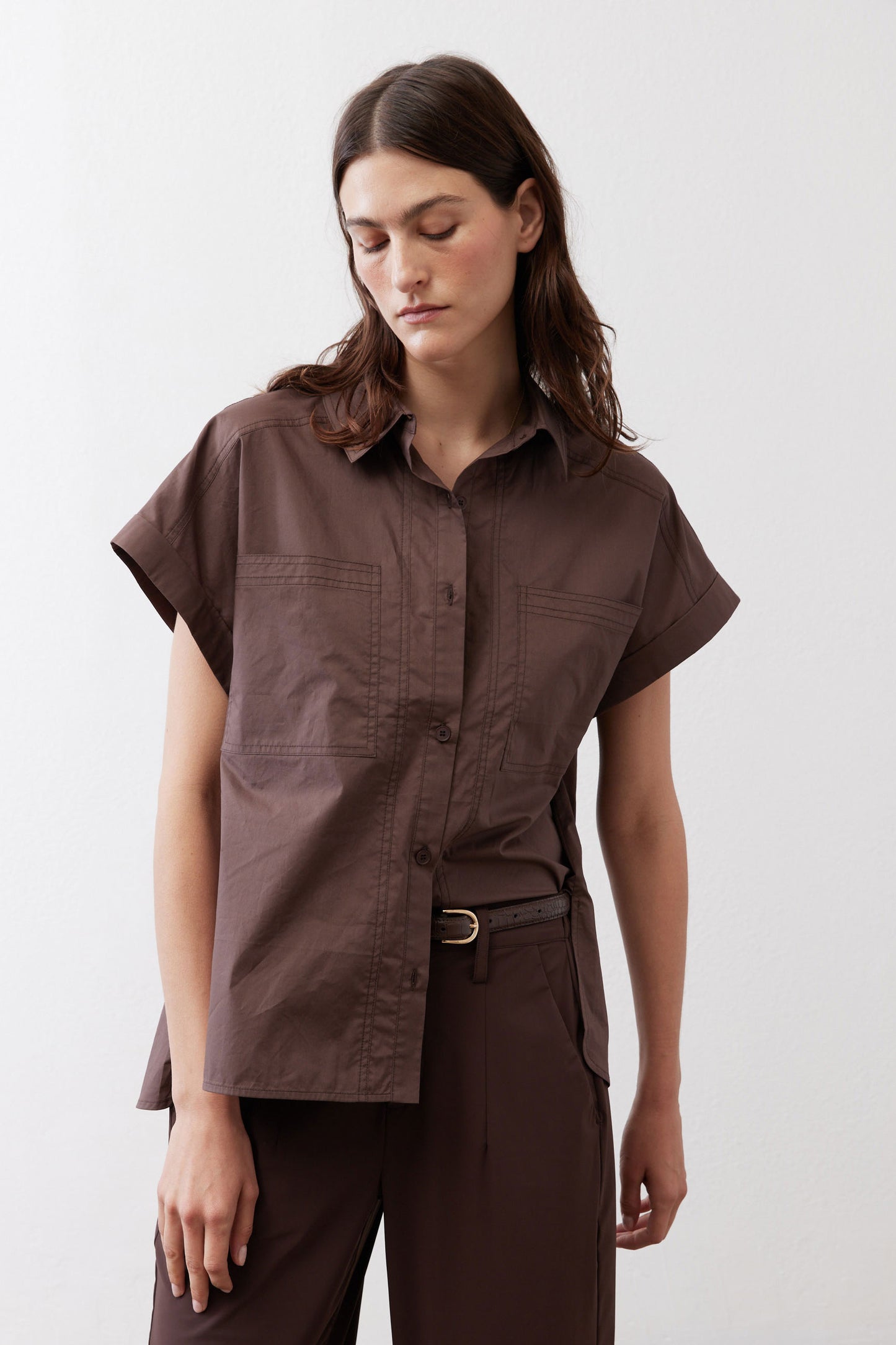 Chocolate short-sleeve button-down blouse with point collar and visible chest pockets