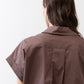 Chocolate short-sleeve blouse back with yoke seam and button placket