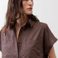 Chocolate poplin button-down blouse close-up with point collar and chest pocket