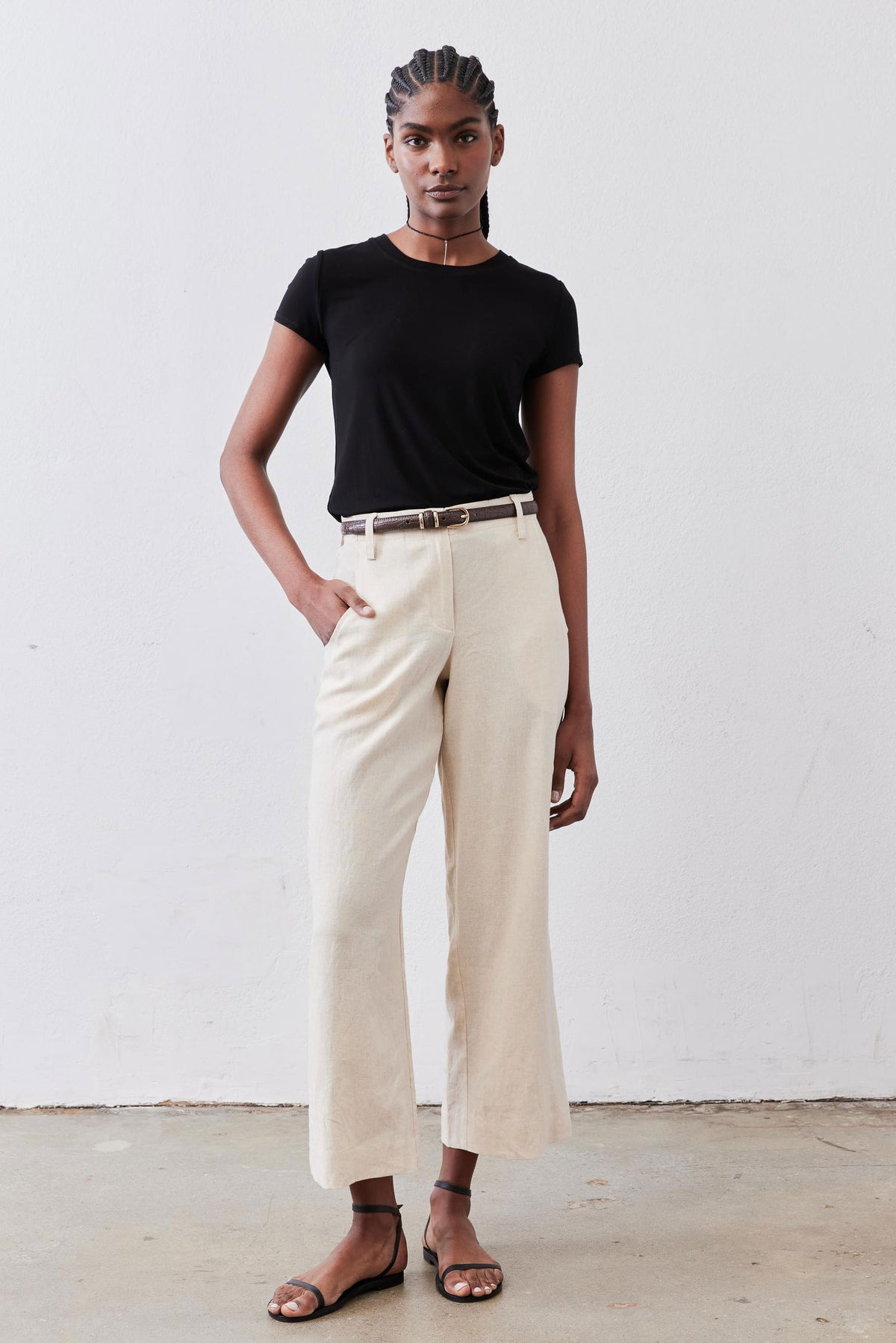 Black short-sleeve crew neck tee with straight neckline and short sleeves