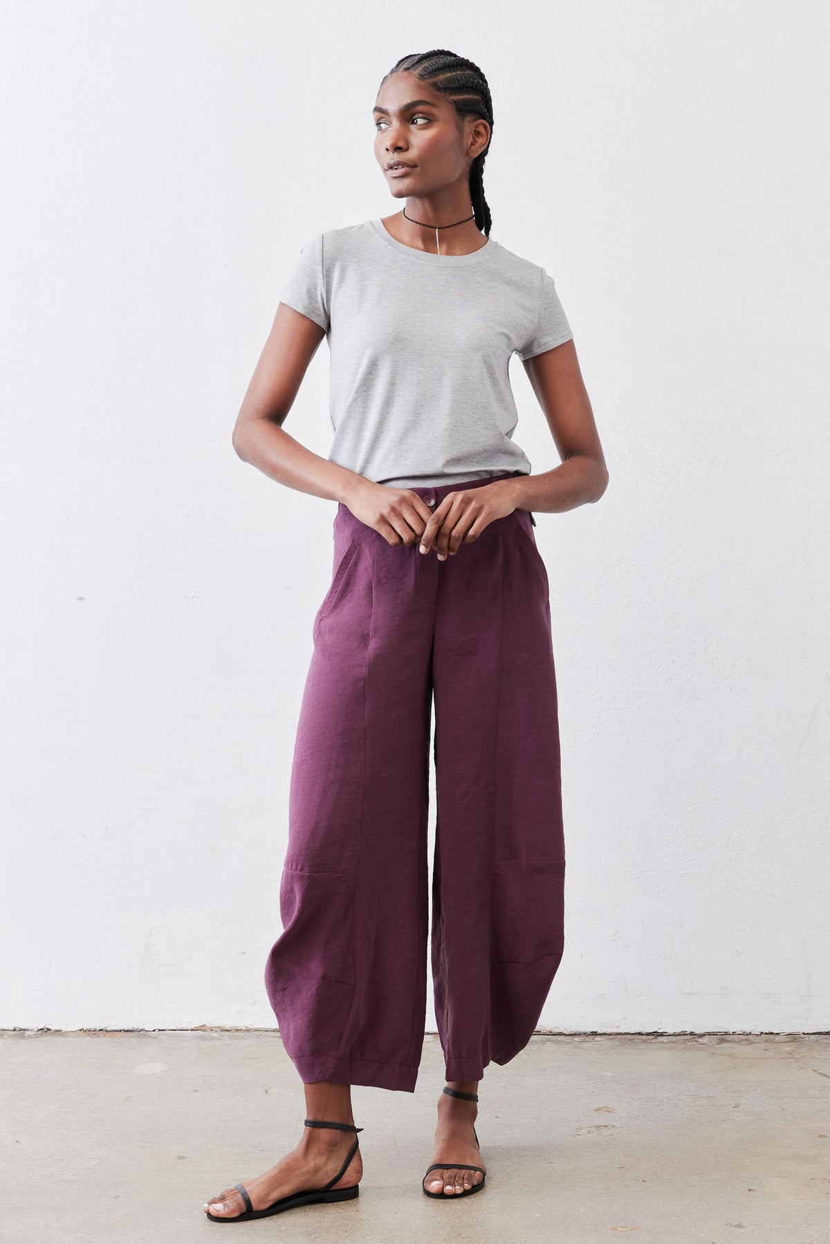 Gray short-sleeve crew neck tee with crew neckline, front view on model.