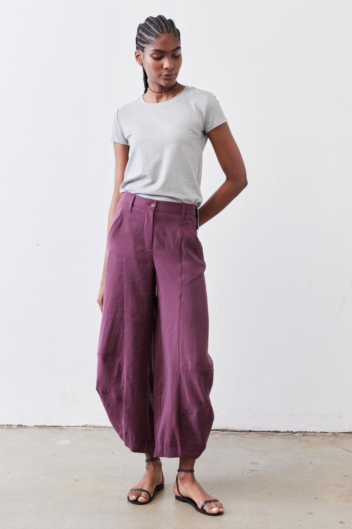 Gray short-sleeve crew neck tee on model, relaxed fit.