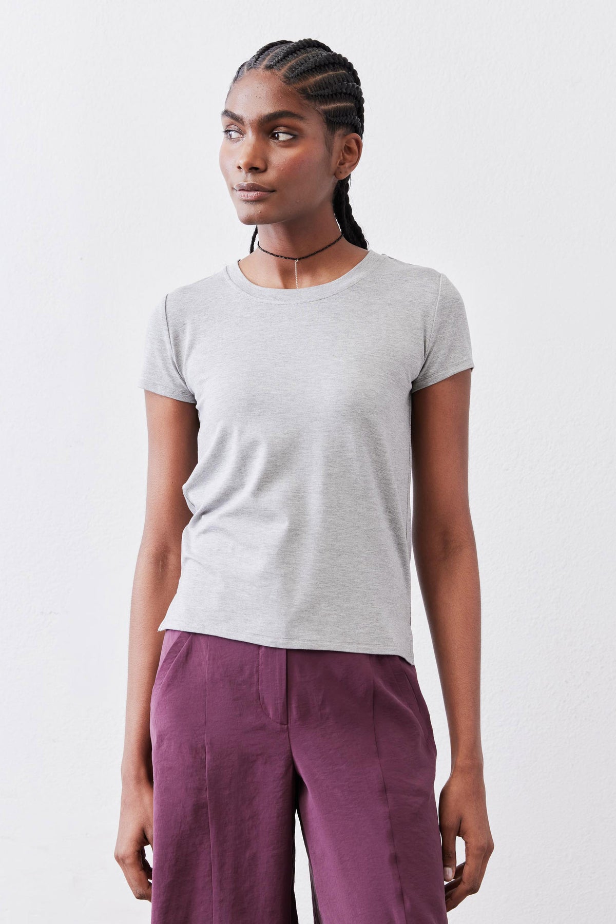 Gray crew neck tee with short sleeves and smooth knit fabric, front torso view.