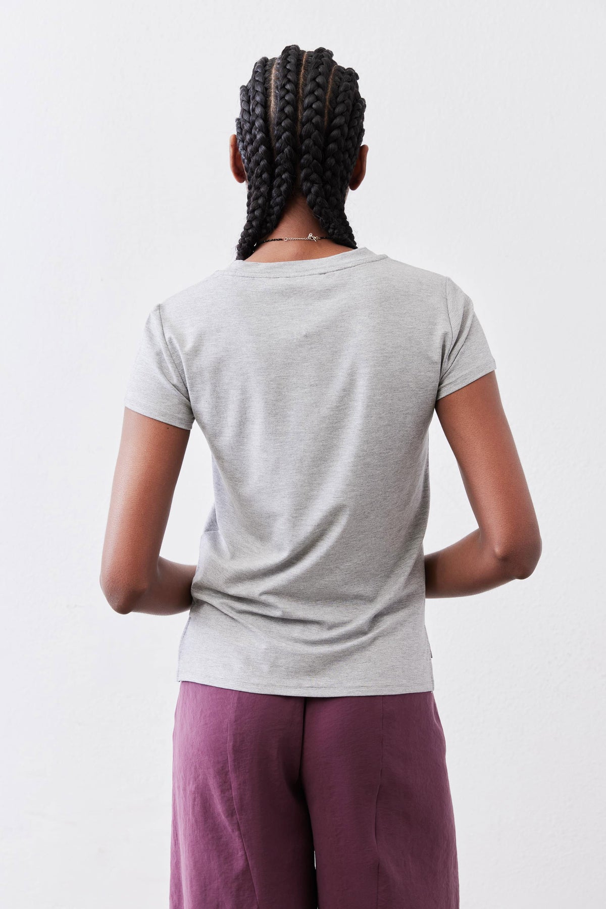 Gray short-sleeve crew neck tee, seen from back.