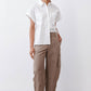 White short-sleeve button-down blouse with patch pockets and relaxed fit
