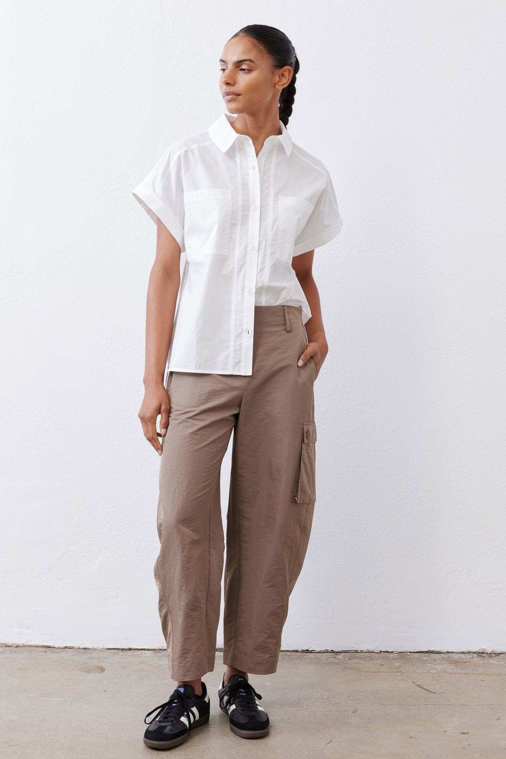 White short-sleeve poplin button-down blouse with pointed collar and front button placket