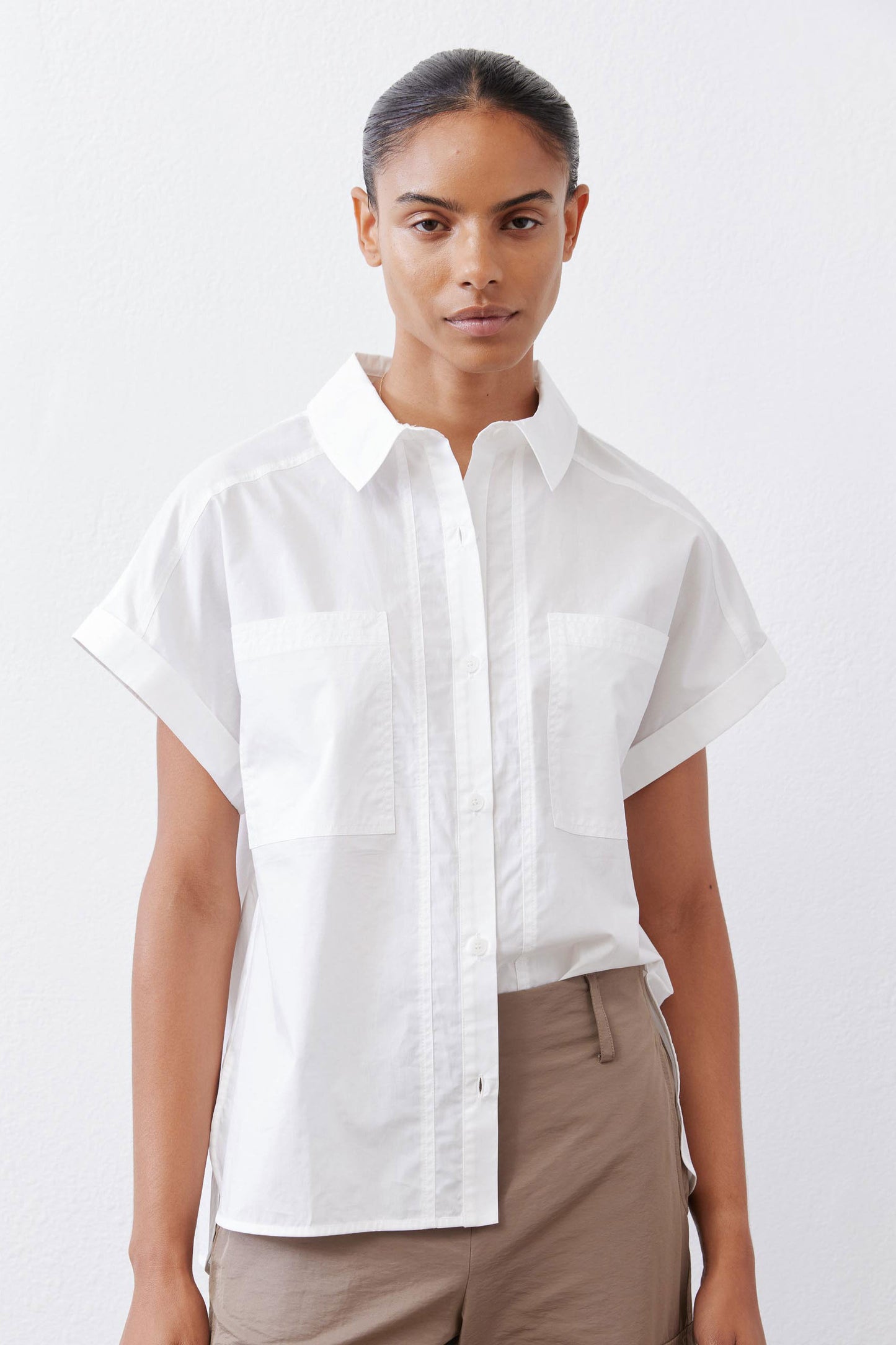 White short-sleeve poplin button-down blouse with patch pockets and pointed collar