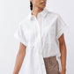 White short-sleeve button-down blouse with front placket and patch pocket