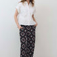 White short-sleeve button-down blouse with pointed collar and stitched chest pocket