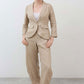 Light beige linen pants with elastic waist, roomy fit, buttoned front and side pockets