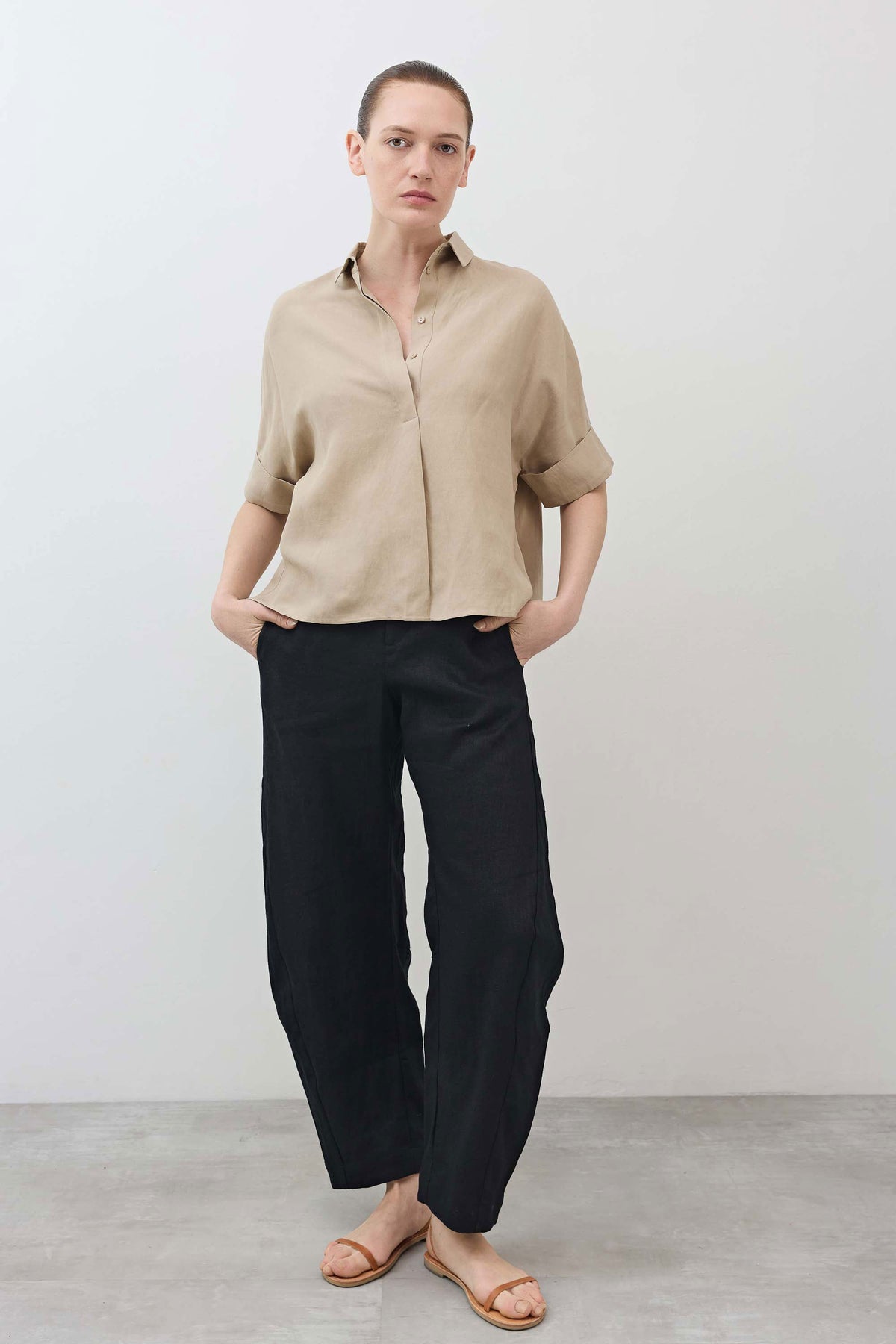 Black linen loose pants full-body view with relaxed wide-leg drape