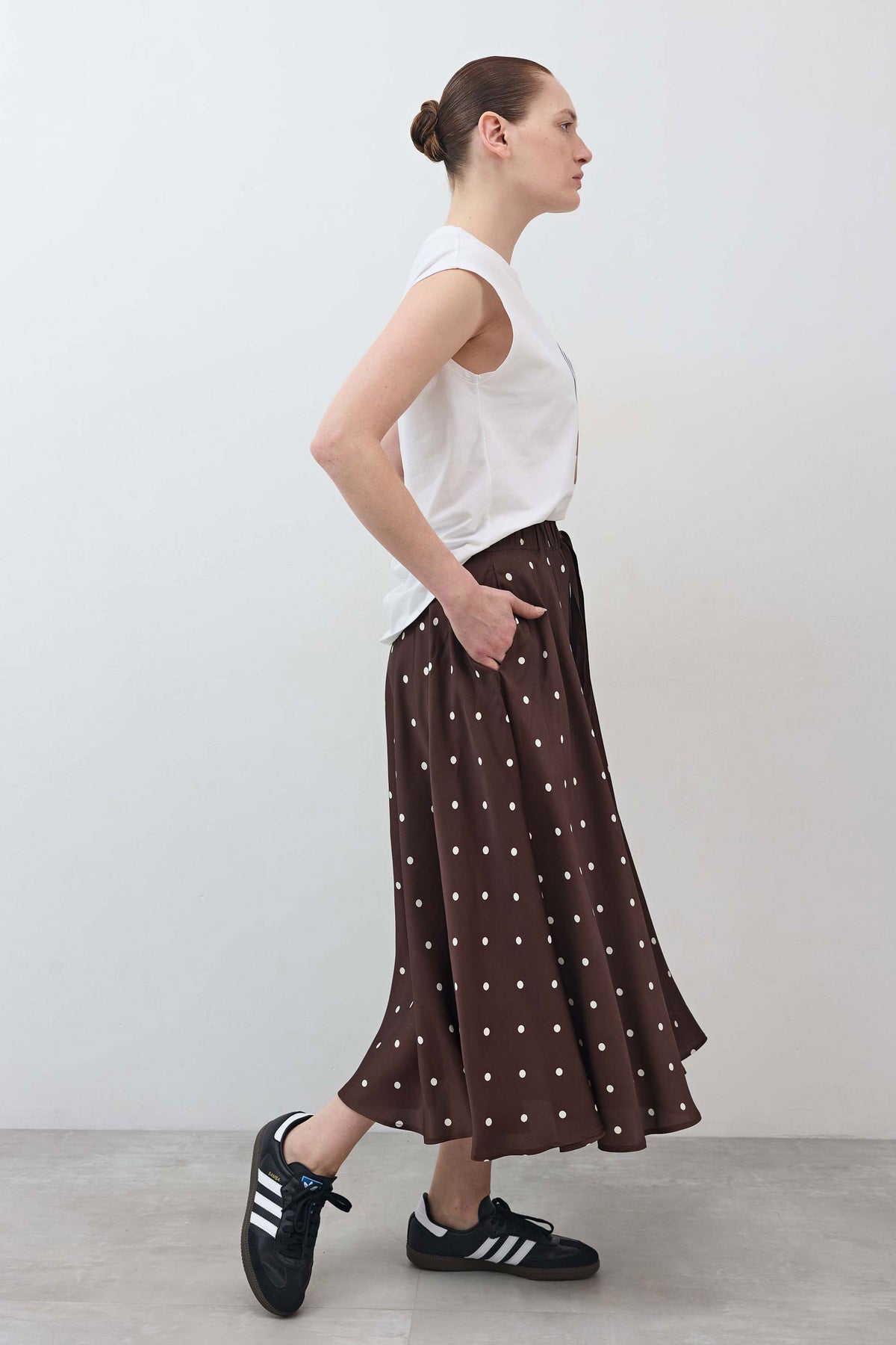 Brown polka-dot pull-on maxi skirt with gathered waist and flared hem