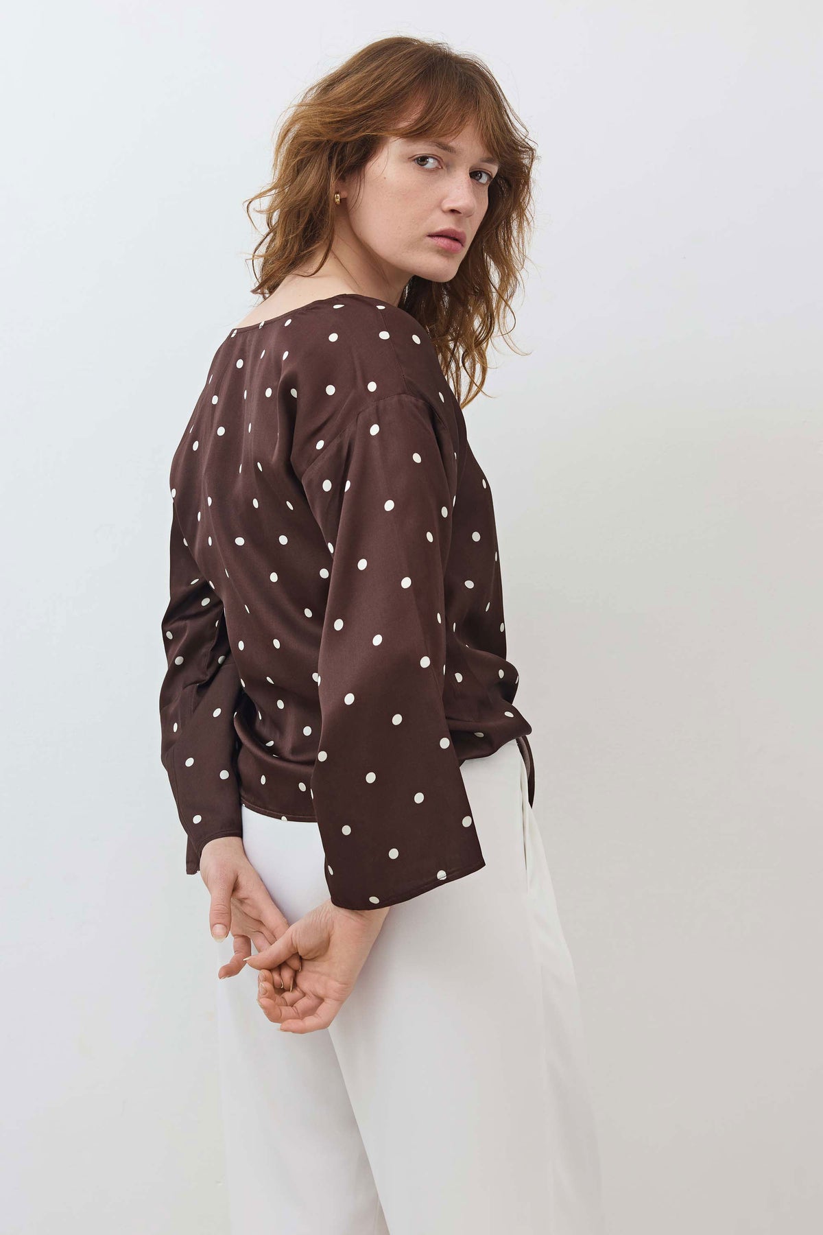 Silky tie-front blouse, brown with white polka dots, long sleeves and tied waist bow
