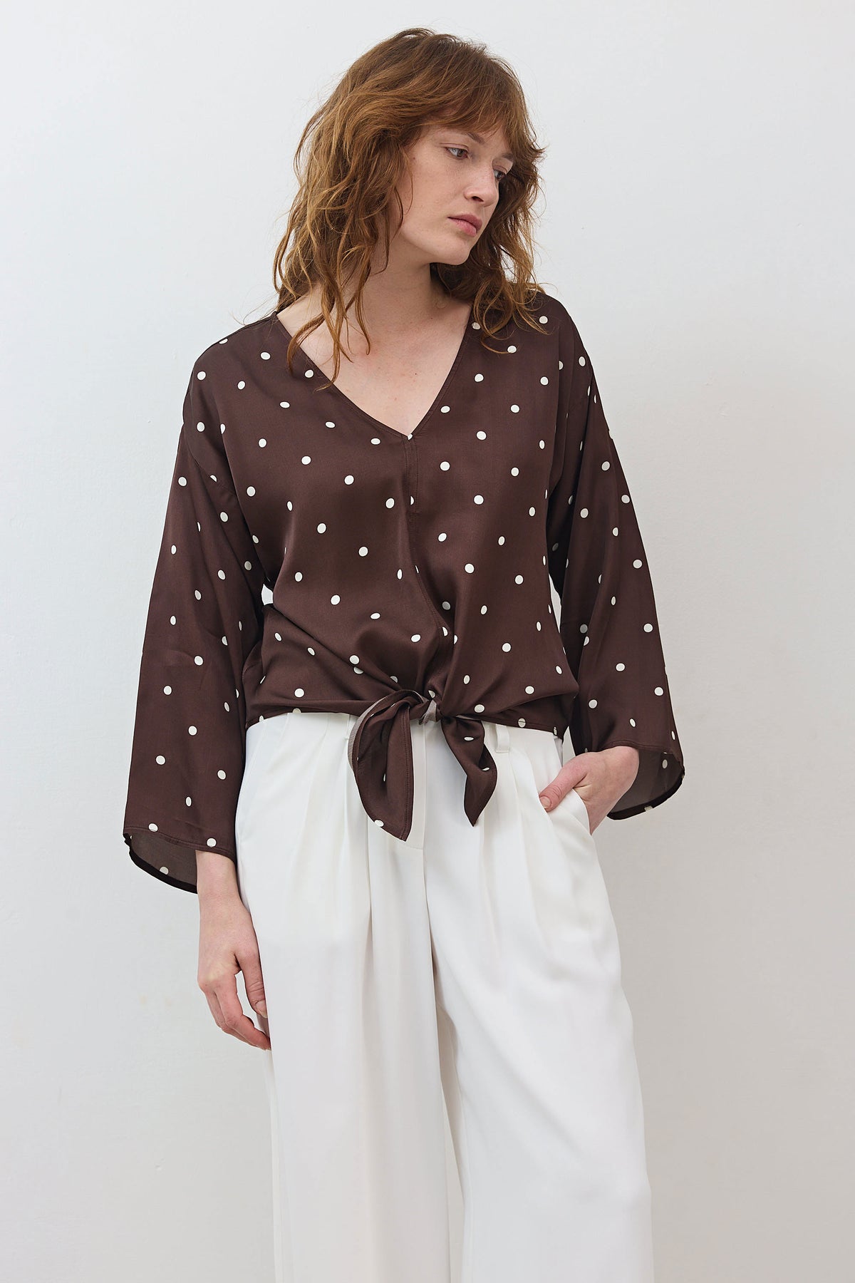 Silky tie-front blouse with V-neck, brown with white polka dots, tied front knot