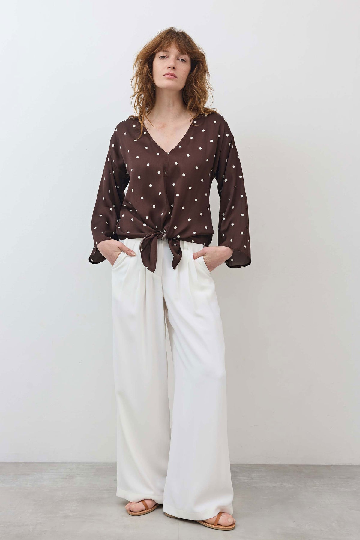 Silky tie-front blouse with V-neck, brown fabric with white polka dots, long sleeves