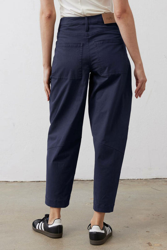 Deep sea slouchy twill pants with straight legs and cuffed ankle hems, back view