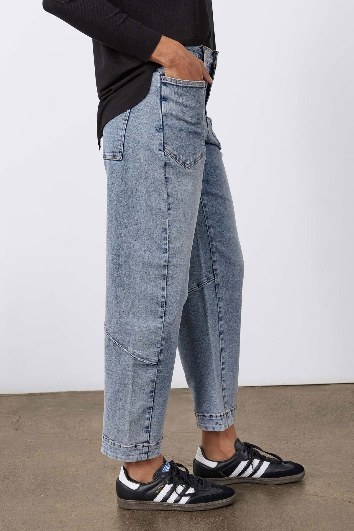 Light blue vintage-wash slouchy jeans with cuffed hems and front pockets