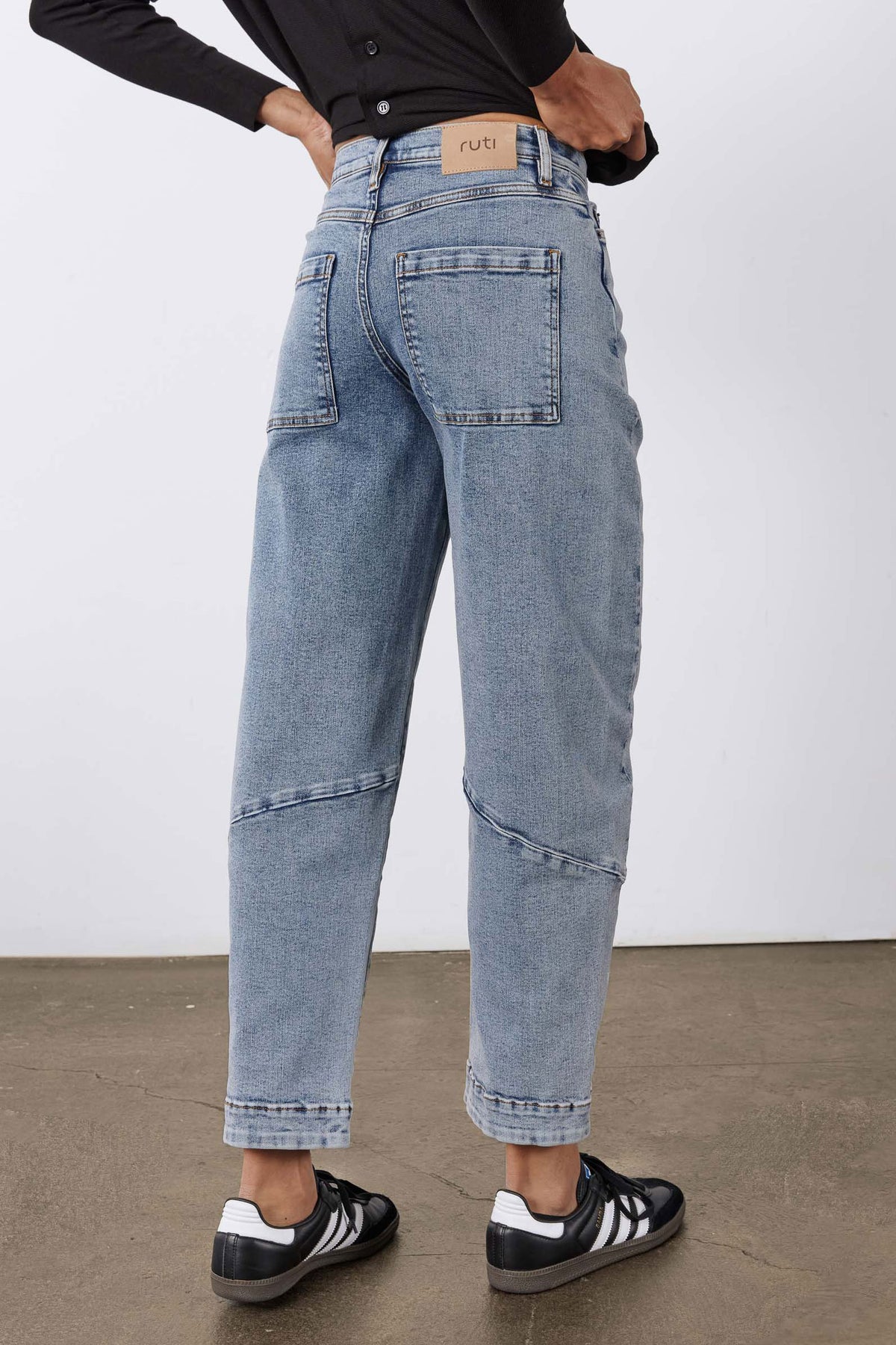 Light blue vintage-wash slouchy jeans with back yoke and patch pockets