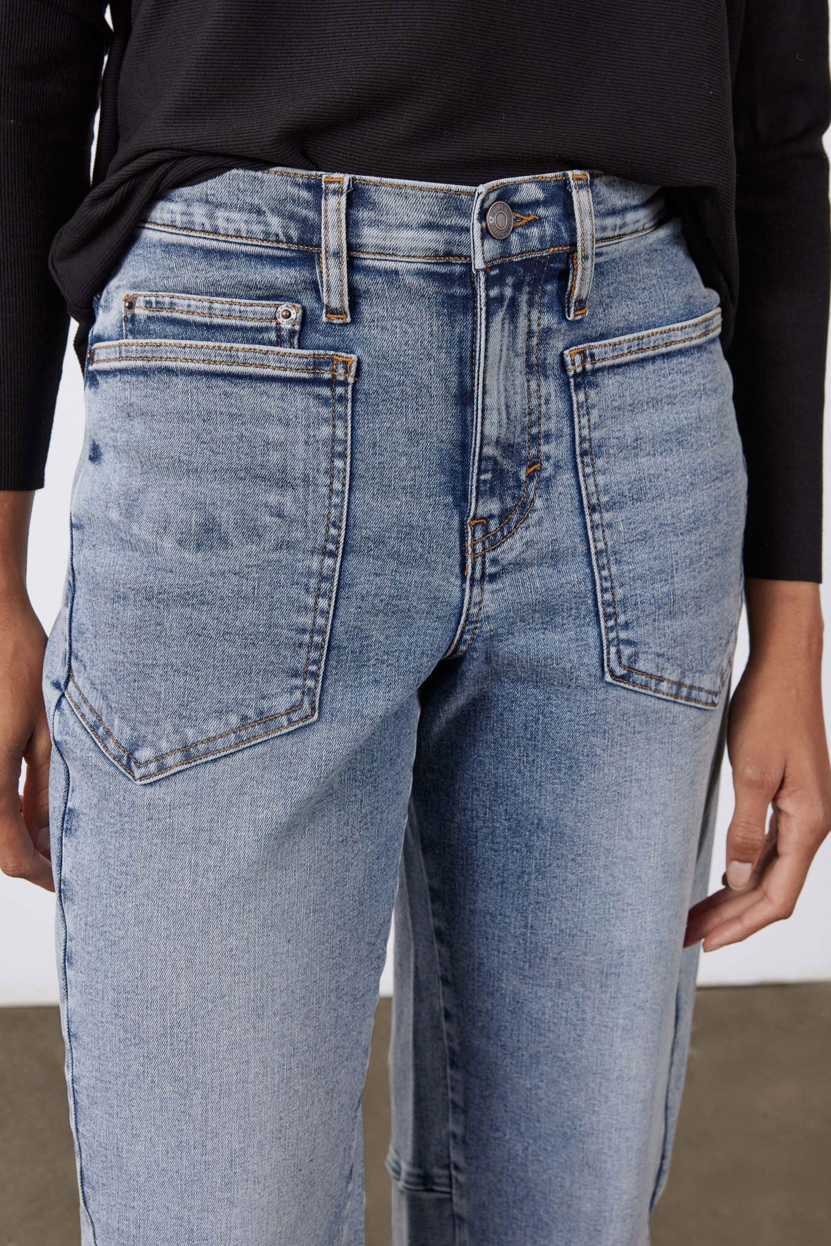 Light blue vintage-wash slouchy jeans with roomy back pockets and belt loops