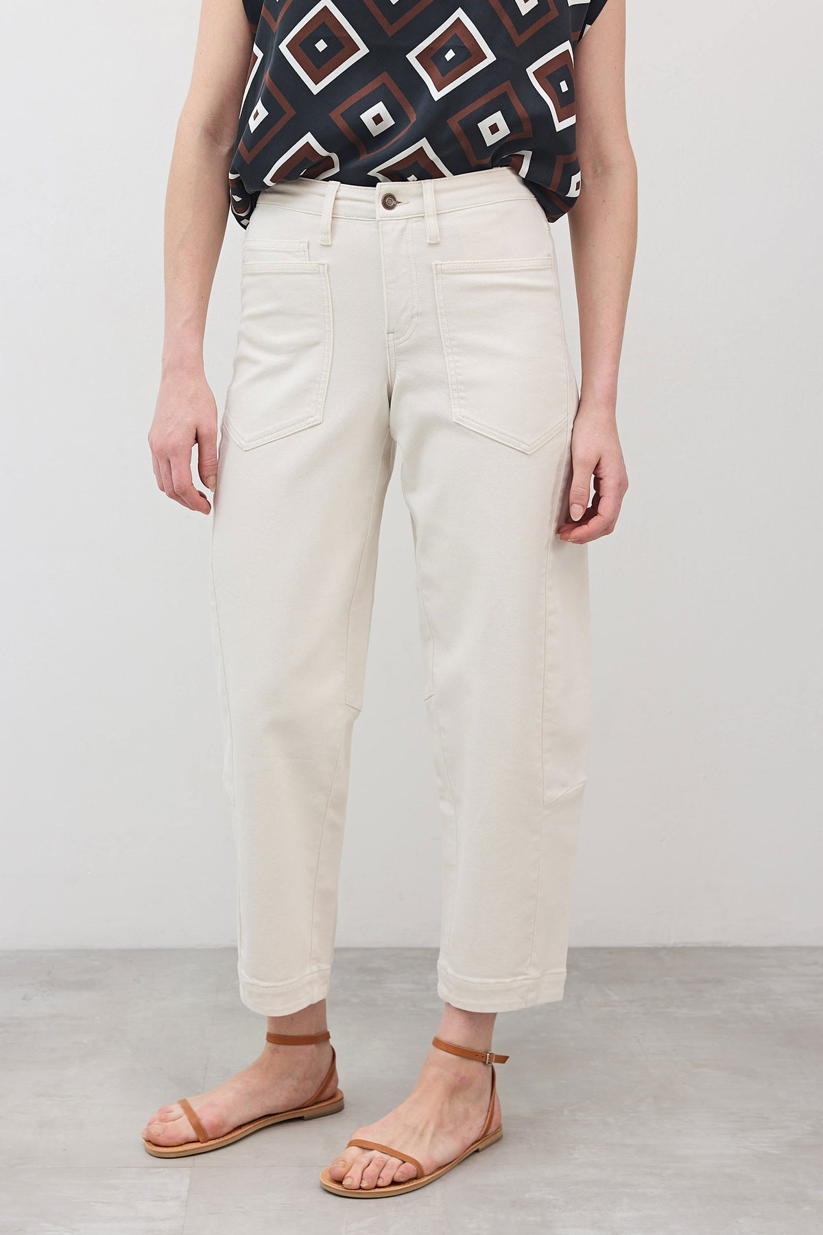 Vintage white wash slouchy jeans with relaxed fit, front pockets, and belt loops