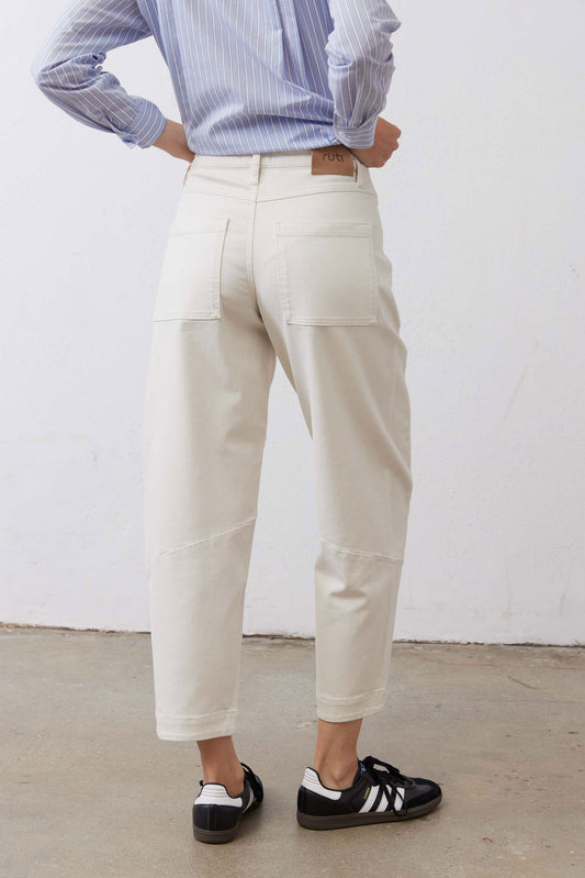 Vintage white slouchy jeans, back view with patch pockets and cuffed hem