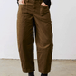 Olive slouchy twill pants with elastic waist and back pocket seams, side view