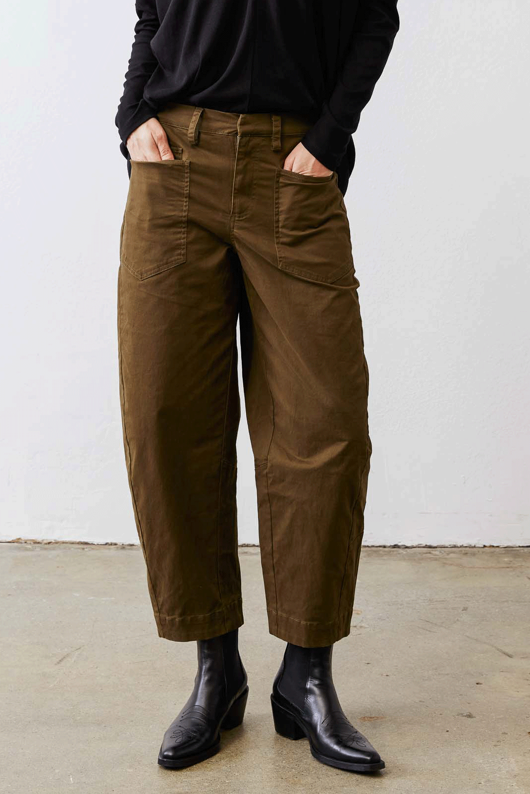 Olive slouchy twill pants with elastic waist and back pocket seams, side view