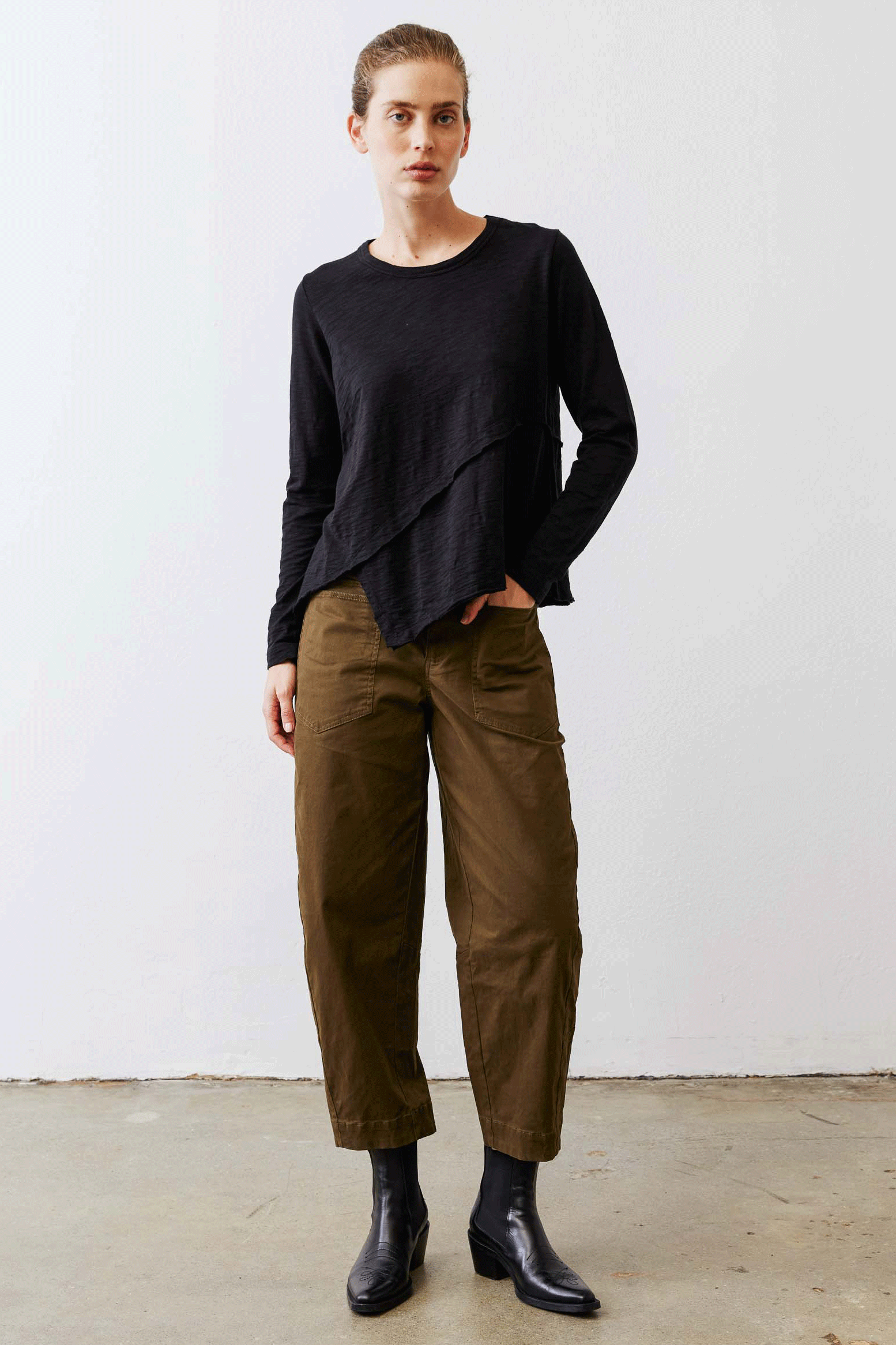 Olive slouchy twill pants with elastic waistband and front pockets, model full view