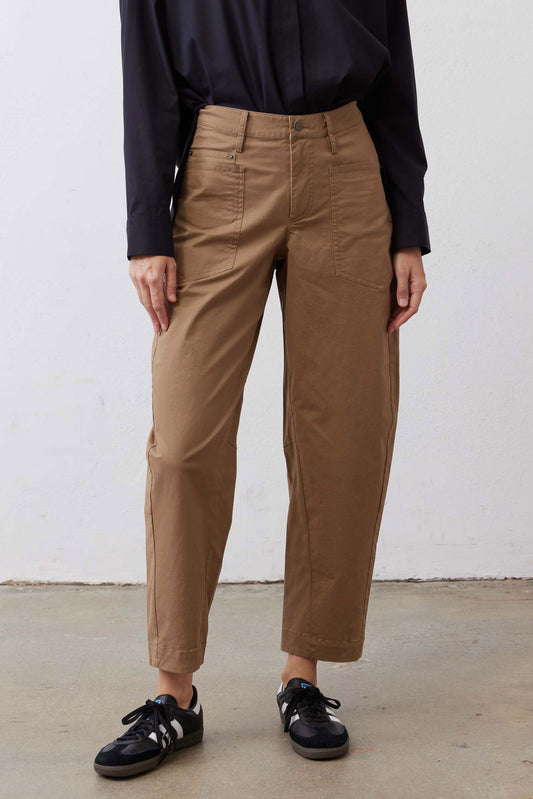 Relaxed tan twill pants with belt loops, front pleats, and ankle-crop hem.