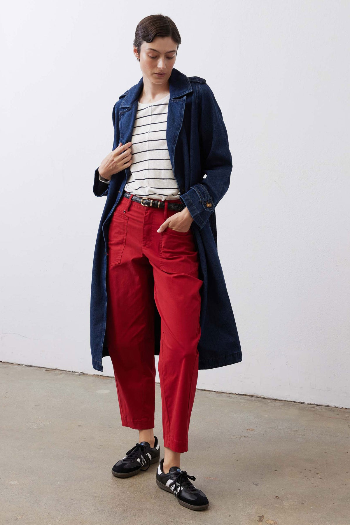 Scarlet slouchy twill pants with belt loops and cuffed hem, styled with sneakers