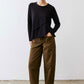 Olive slouchy twill pants with elastic waistband and side pockets, full body view