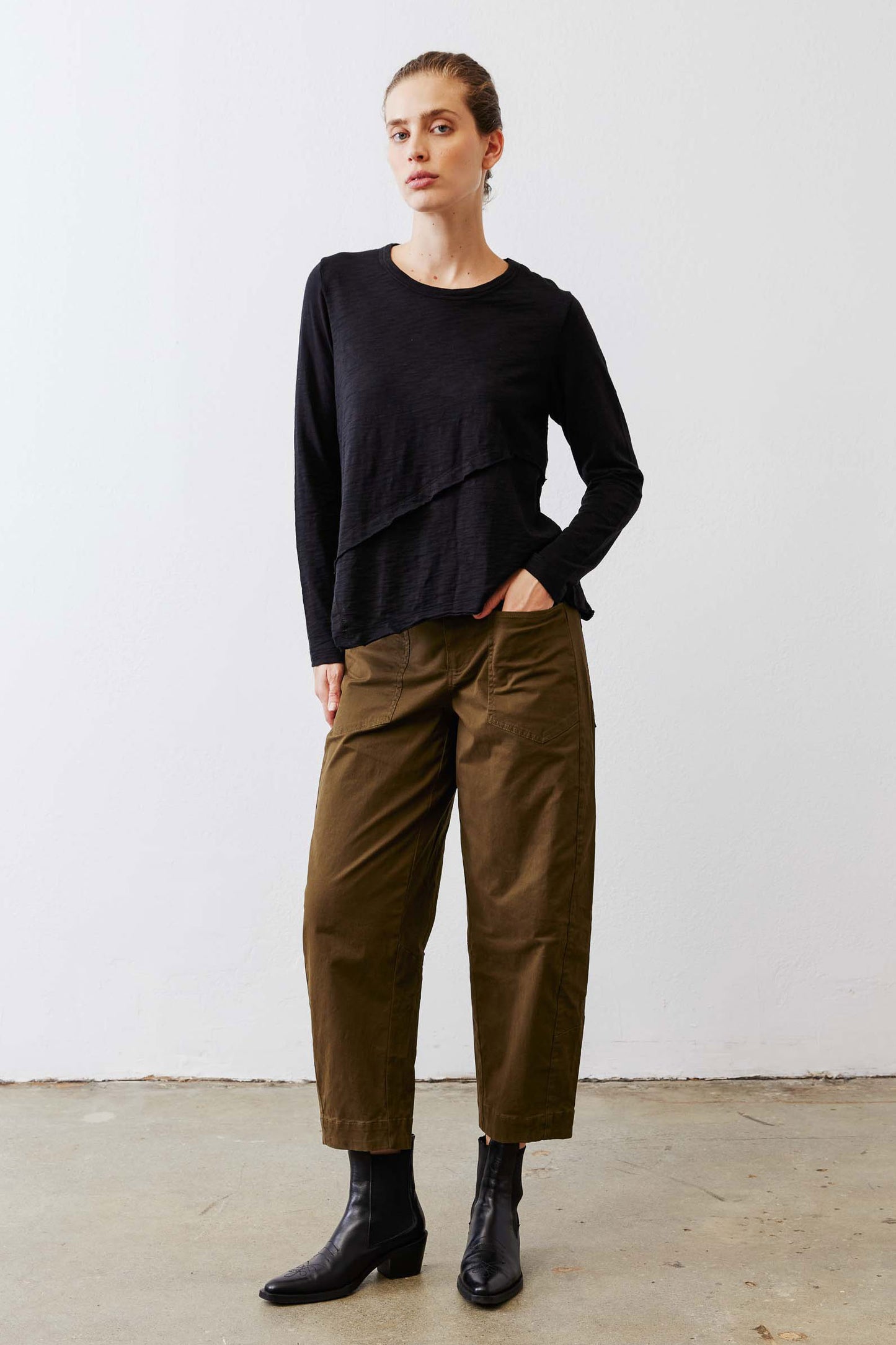 Olive slouchy twill pants with elastic waistband and side pockets, full body view