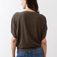 Olive short sleeve top with back view and slightly dropped shoulders