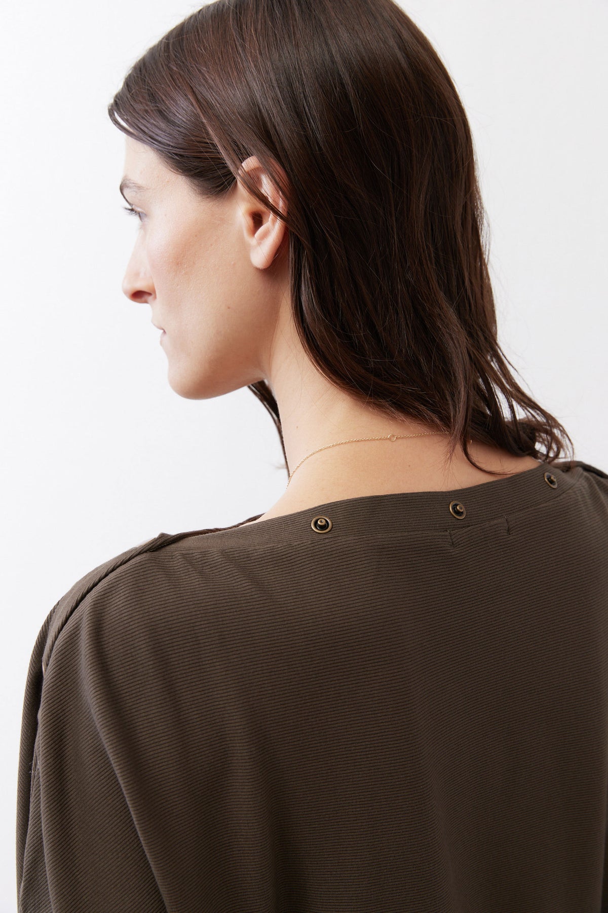 Olive short-sleeve top with two-button neckline at the back shoulder