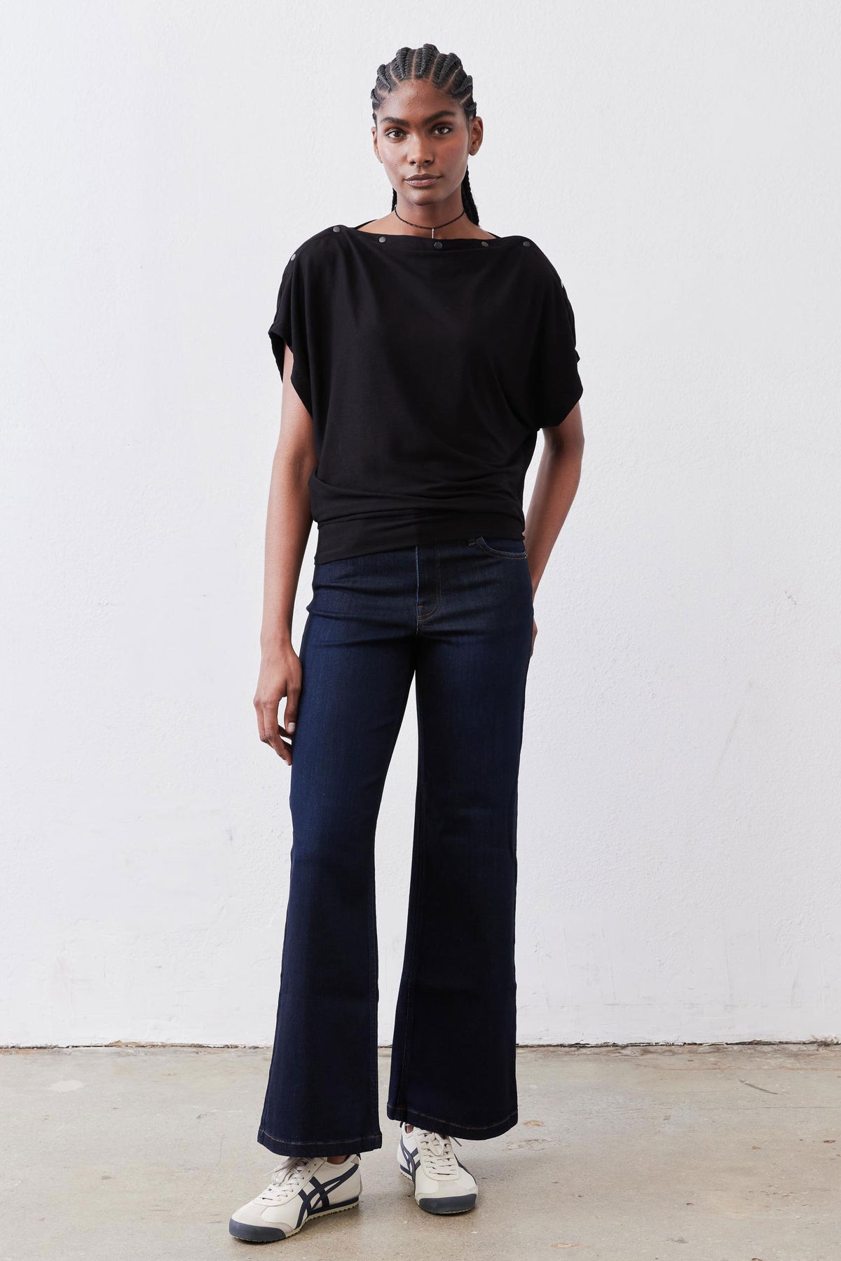 Black short-sleeve top with crew neck and relaxed fit