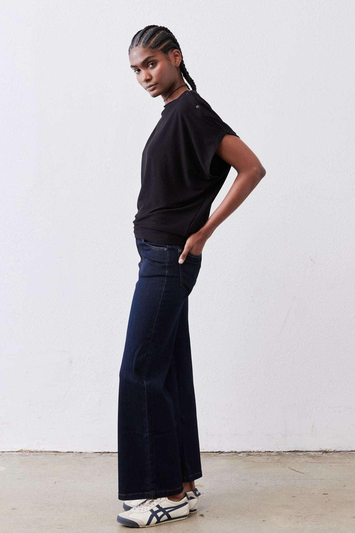 Black short-sleeve top with crew neck and roomy sleeves