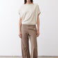 Cream short-sleeve draped top with button detail at the neckline