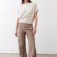 Cream short-sleeve draped top with buttoned neckline and relaxed hem