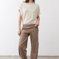 Cream short-sleeve top with draped fit and buttoned neckline