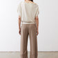 Cream short-sleeve back top with gathered back yoke and shoulder buttons