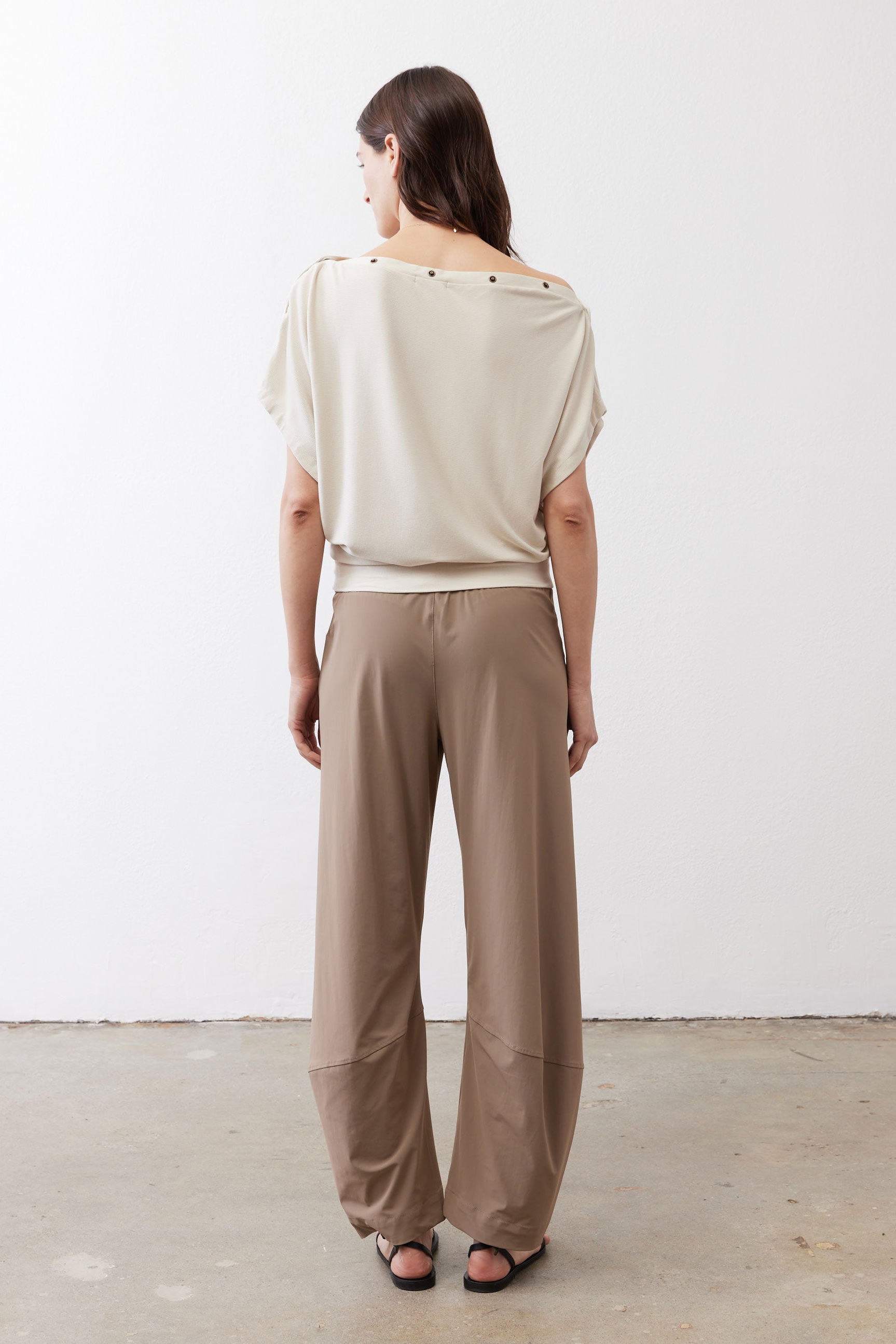 Cream short-sleeve back top with gathered back yoke and shoulder buttons