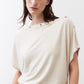 Cream short-sleeve top with round neckline and buttoned placket