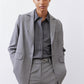 Gray melange squared off blazer with notch lapels, two button cuffs, flap pockets
