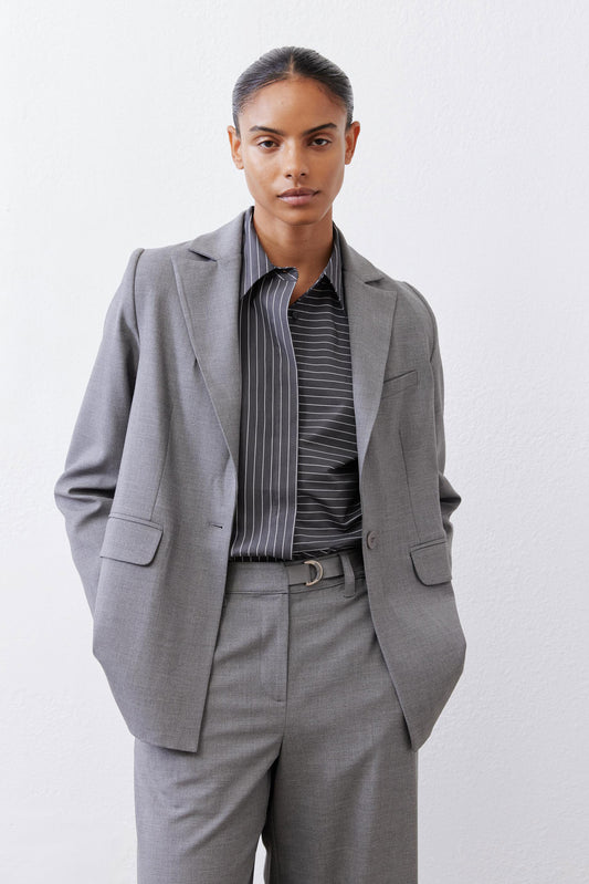 Gray melange squared off blazer with notch lapels, two button cuffs, flap pockets