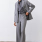 Gray melange squared off blazer with open front, square lapels, and flap pockets