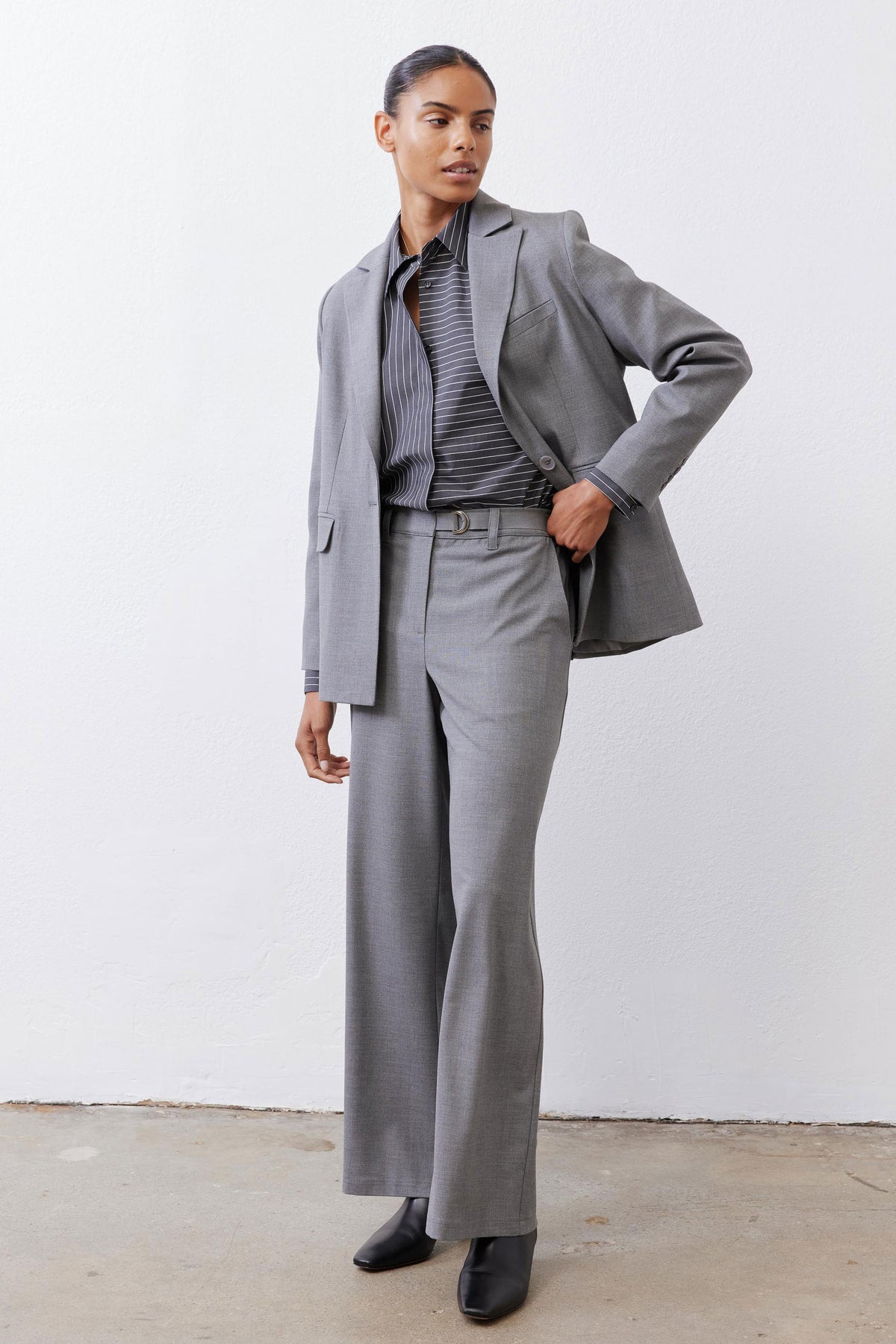 Gray melange squared off blazer with open front, square lapels, and flap pockets