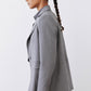 Gray melange blazer back view with squared shoulders and single-button cuff
