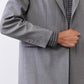 Gray melange blazer sleeve and cuff detail with four decorative buttons