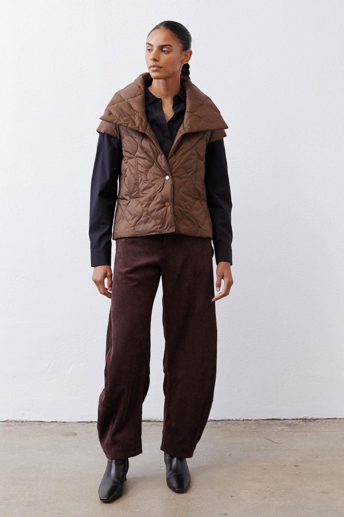 Quilted down vest in coffee brown with button-front and stand collar, sleeveless