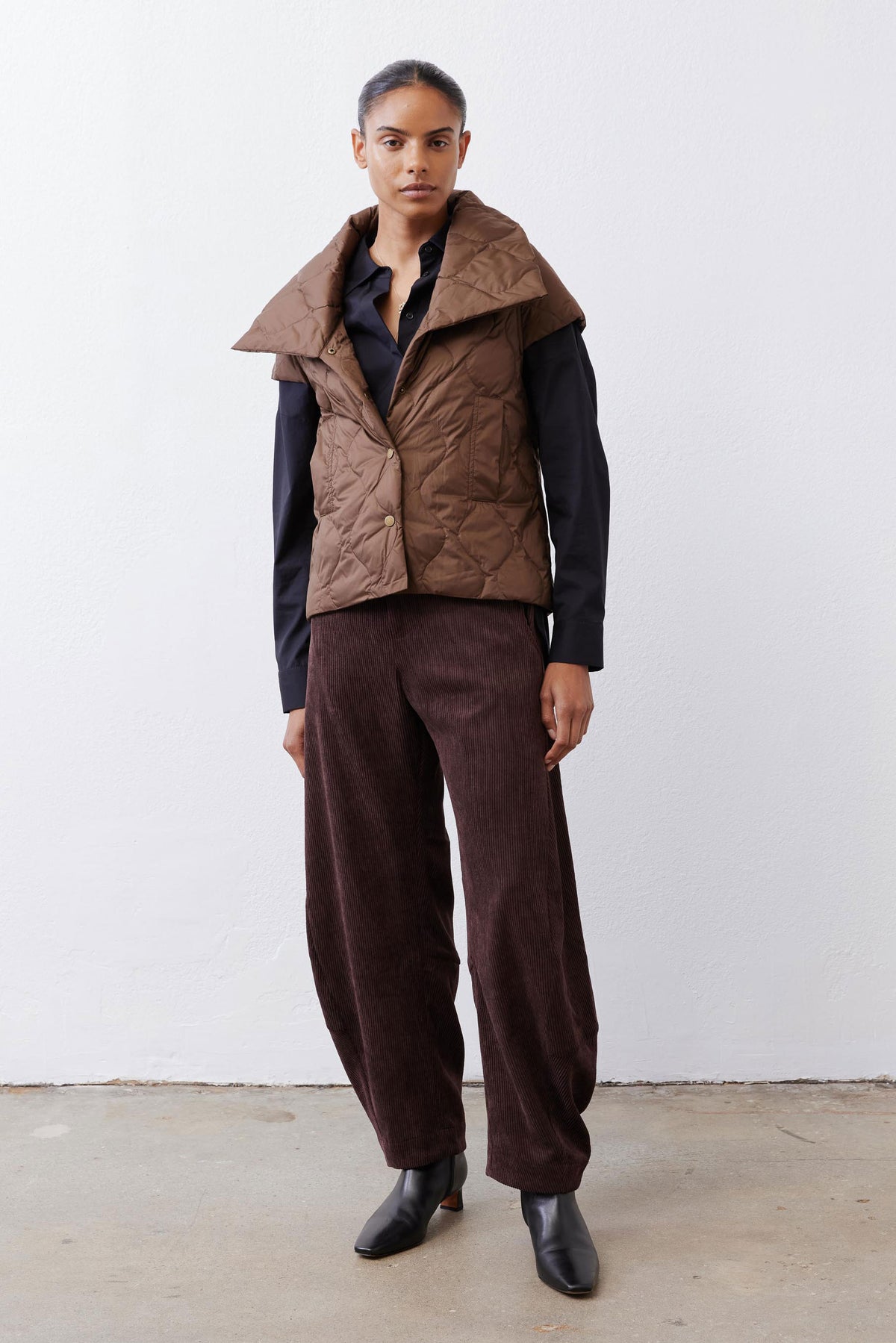 Coffee brown quilted down vest, sleeveless, button-front with stand collar detail